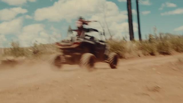 Side-by-side kicking up dust